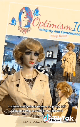 Curly blonde wigs and beige jacket dresses at Optimismic Wigs and Gifts. Minnesota wigs stores. Hair wigs stores in St Paul Minnesota. Wigs near Minneapolis.