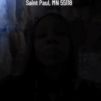 Tacandrya Patterson CEO modeling Black human hair lace front wigs and crystal bow tie necklace at Optimismic Wigs and Gifts St Paul Minnesota. 