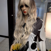Shop phoebe blonde water wave hair wigs with bangs near me at optimismic wigs and gifts shop st paul minnesota.