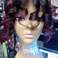 Custom 1/30 Ambition 100% Human Hair Lace Front Wig at Optimismic Wigs and Gifts. Curls that Flip with Raspberry Tips. Come Check out the Ambition Wigs at OptimismIC Wigs and GiftsWig BenefitsUnlimited Styling options5 Minute StylingCut Lace Wear and GoPre-styled and Pre-coloredGlueless for easy wearAmbition 100% Human Hair Lace Front Wig Product Details Hair Wig Color: Natural 1b/ Raspberry TipsHair Wig Coverage: Full CoverageHair Wig F