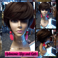 Cool and Casual Gina Wigs at Optimismic Wigs and Gifts. Short and lightweight and dancefloor ready come down and check them out.

Wig Benefits

5 Minute Styling

Wear and Go

Pre-styled and Pre-colored

Glueless for easy wear

Lucille Wig Product Details 

Hair Wig Color: Sepia

Hair Wig Coverage: Full Coverage

Hair Wig Fiber: Synthetic 

Heat Resistant: Yes

Hair Pattern: Short Layers with bangs

Hair Length: Medium Length 4 inches

