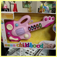 Infant Guitar at OptimismIC Wigs and Gifts