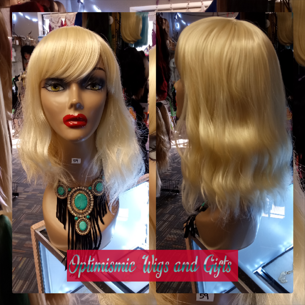 Blonde wigs with bangs at Optimismic Wigs and Gifts west saint paul. Shimmers Blonde Synthetic Glueless bang Wig $25 at Optimismic Wigs and Gifts West St Paul MN